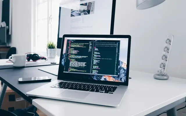 Laptop showing website code