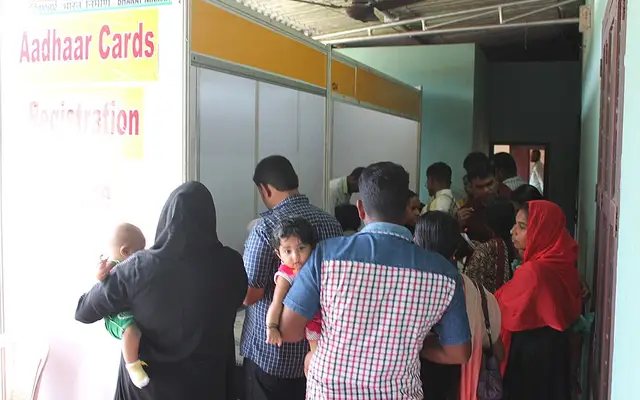 People queuing at an Aadhaar registration counter